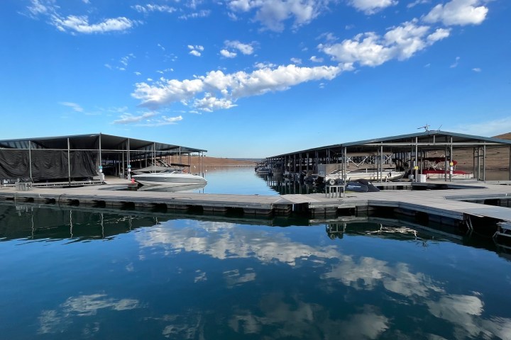 a boat is docked next to a body of water
