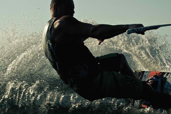a man riding a wave on a surfboard in the water