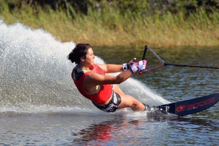a person riding a surf board on a body of water