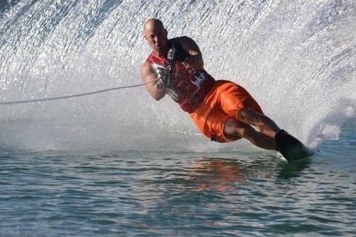 a man riding a wave on top of a body of water