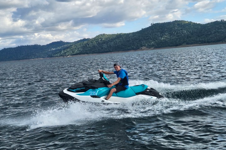 a man riding a wave on top of a body of water